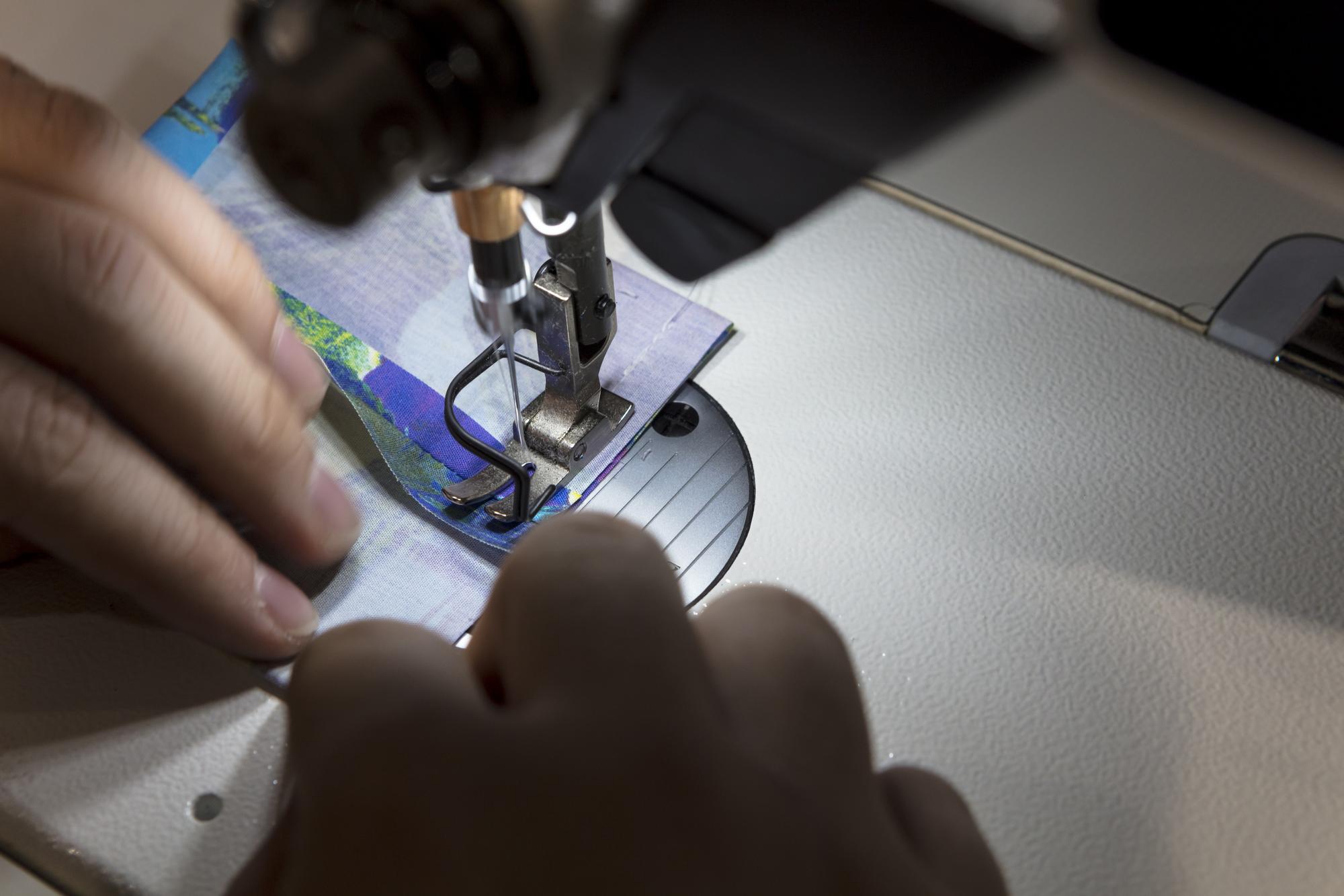 close view of embroidered label being inspected
